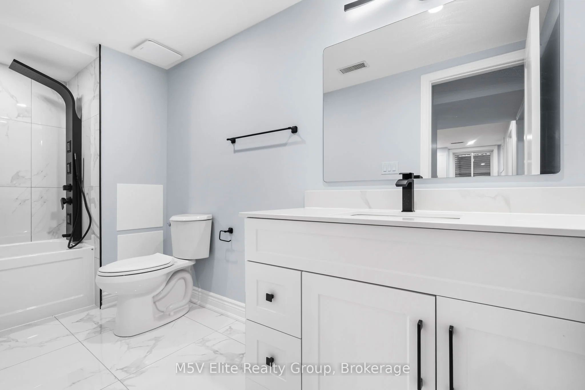 Brand-new marble bathroom with modern fixtures